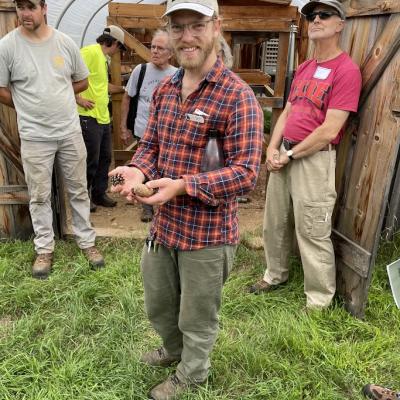 Forester Ben Aldrich holds a seed.