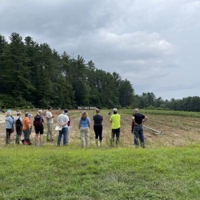 Forest Society volunteers look at the seed beds at the nursery.