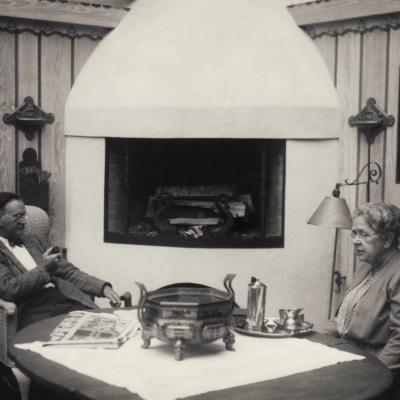 Frances Glessner Lee meets with someone on the porch.