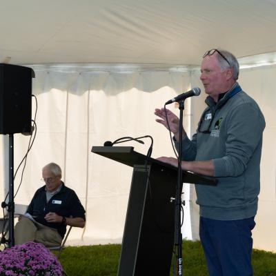 Jack Savage speaks on stage.