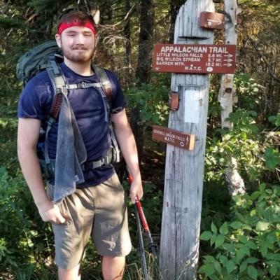 Adam Gough poses outdoors.