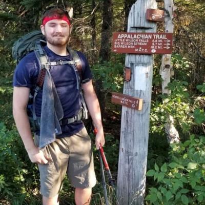Adam Gough poses outdoors.