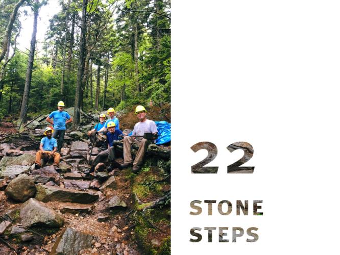 Newly finished stone steps blend into the existing rocky trail