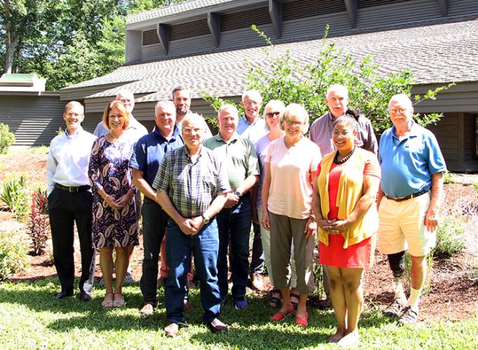 The board poses in front of the Conservation Center.