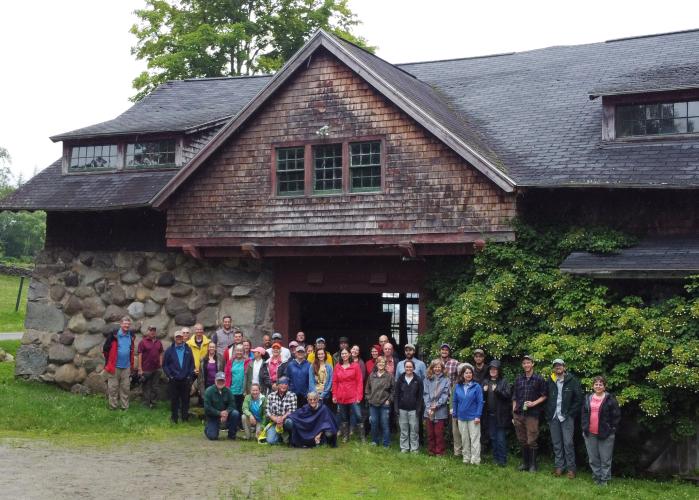 Forest Society staff pose on a rainy day outside the carriage barn at The Rocks.