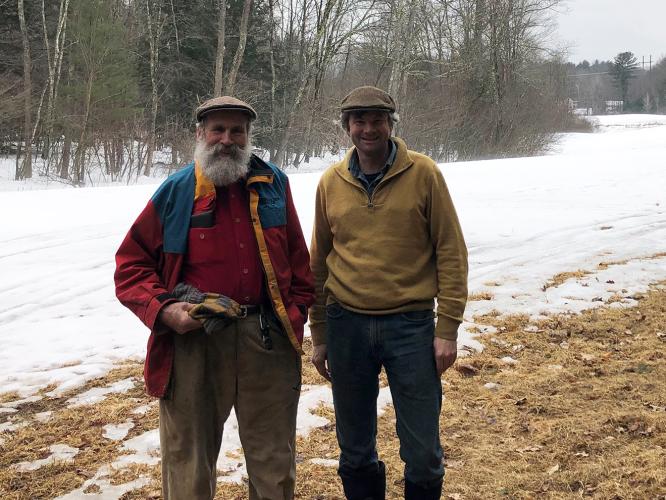 Dorn and Chuck Cox pose in front a snow covered field at Tuckaway Farm.