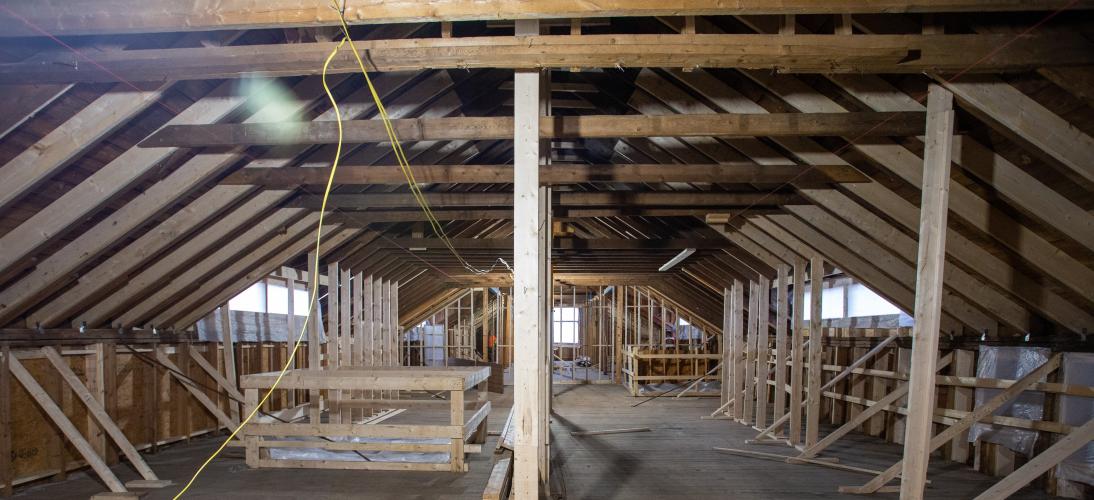Open beams and construction materials are on view in the upstairs of the Carriage Barn.