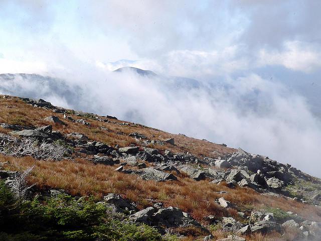 A southwesterly view of Mount Washington with clouds above.
