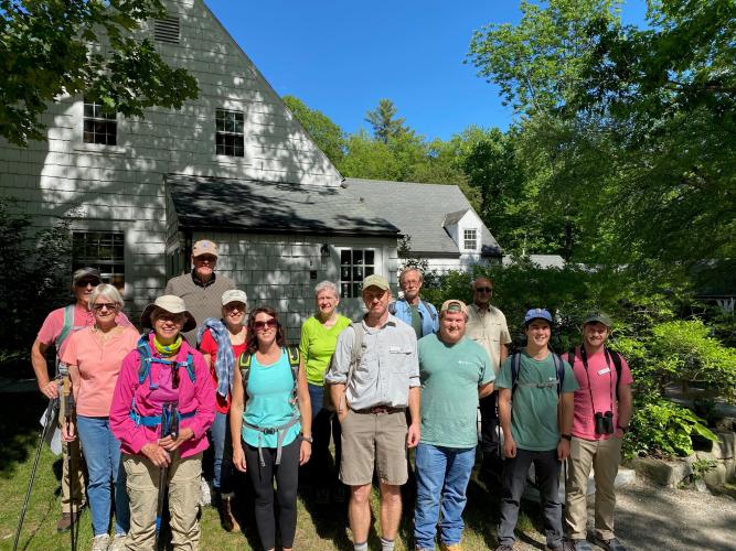 Hikers pose before hike at The Fells Gate House Visitor Center