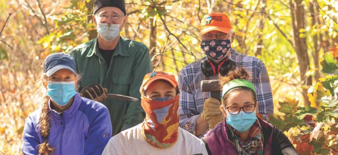 Masked members of the Forest Society's conservation corps gather.